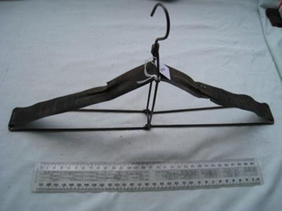 Coat hanger - folding - black  wire and t ape one branded C Curran Orange
; SH1968-3056