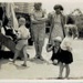 Photo, Two women watch children beside house, Dec 1942; 1942; RAP2020.0160