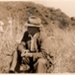 Photo, Man sitting in long grass (II); 1943; RAP2020.0068
