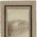 Photo, White hut on farmland, mounted on cardboard; RAP2020.0156