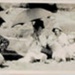 Photo, Three women with hats and umbrellas at beach, baby and child; RAP2020.0011