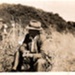 Photo, Man sitting in long grass; 1943; RAP2020.0064