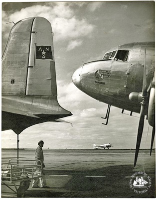 Douglas DC-4 and DC-3 aircraft on ground; Scott, E. T. (The "Age"); c. 1955; PH-981076
