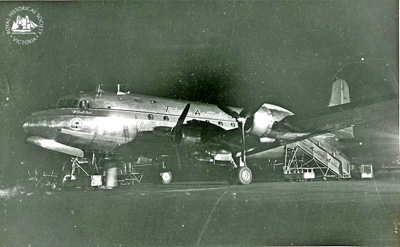 Trans Australia Airlines (TAA) Douglas DC4 Aircraft at night, Essendon Airport.; c. 1950; PH-981054