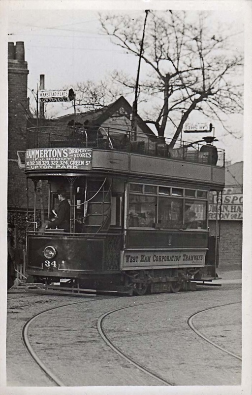Postcard, unlabelled, showing tram at stop showing destination Wanstead