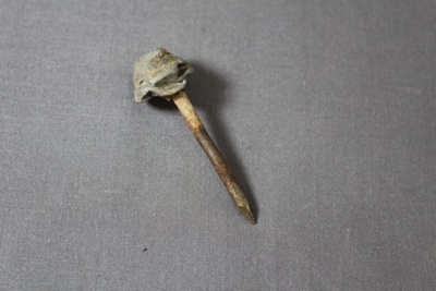 Nail with lead cap; 242 