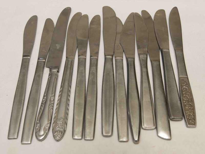 Knives, assorted. Most are serrated on one side of blade.; Unknown ...