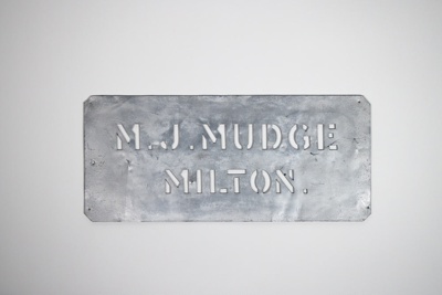 Stencil, metal, for labelling wooden crates with Mudge's cordials; 112