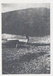 Man with two rowing boats on the beach.; 1920?; ULMPH 2000 1017