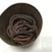 Tin (a) containing tobacco (b); ULM 1996 051 a and b 