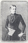 Woman in a long dark dress, holding a book.; 1910?; ULMPH 2000 1019
