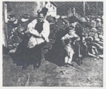 An old man and woman sitting beside a dyke with a  small boy and a baby.; 1900?; ULMPH 2000 1015