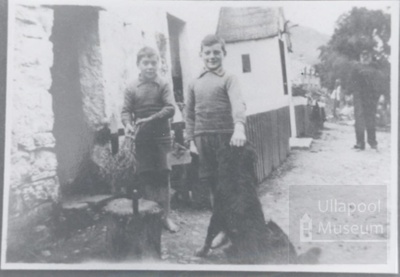 Two young boys and dog outside house at crofton - man in Yacht Jumper in background; ULMPH 2000 0603 