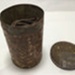 Tin (a) containing tobacco (b); ULM 1996 051 a and b 