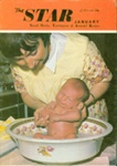 Front cover of The Star booklet, featuring a woman washing a baby in a basin