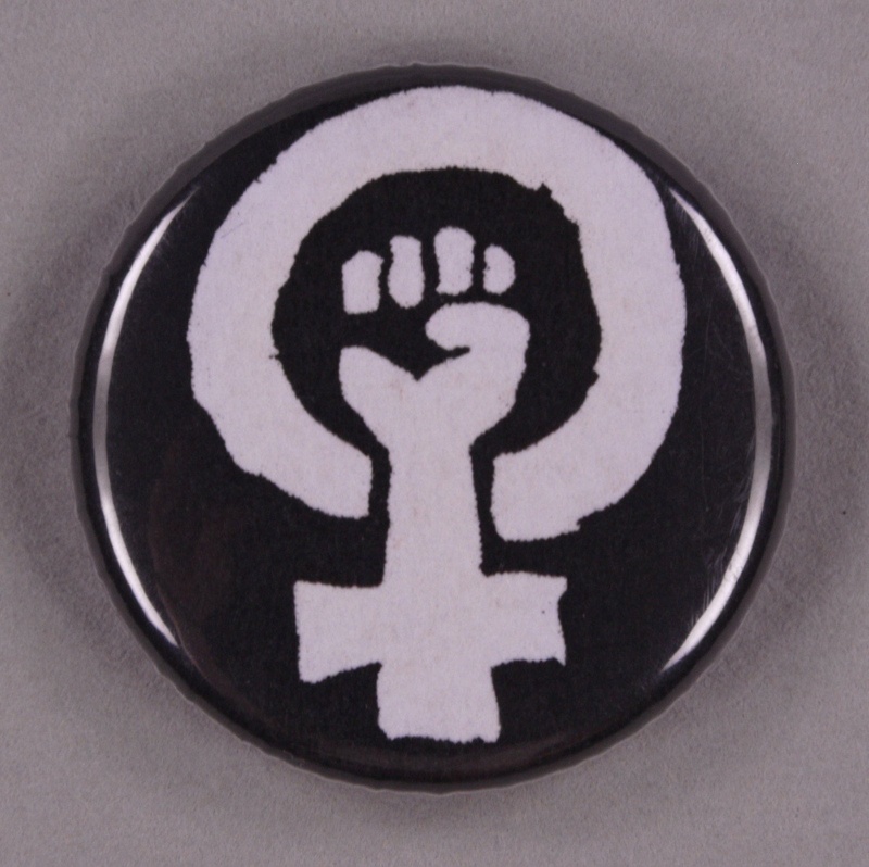 Badge: Feminist power symbol; GWL-2013-29-7