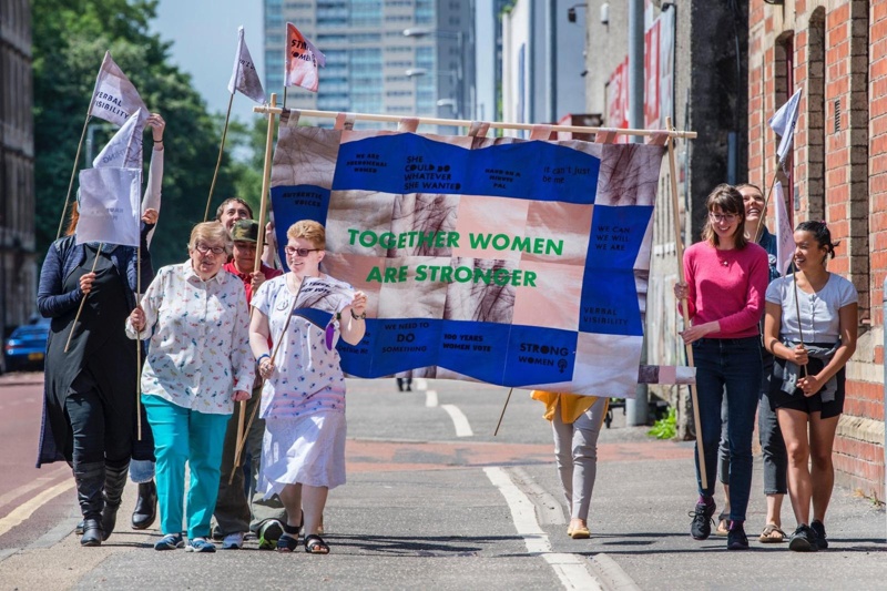 PROCESSIONS banner: Together Women Are Stronger; 2018; GWL-2022-123. Photo credit: John Devlin