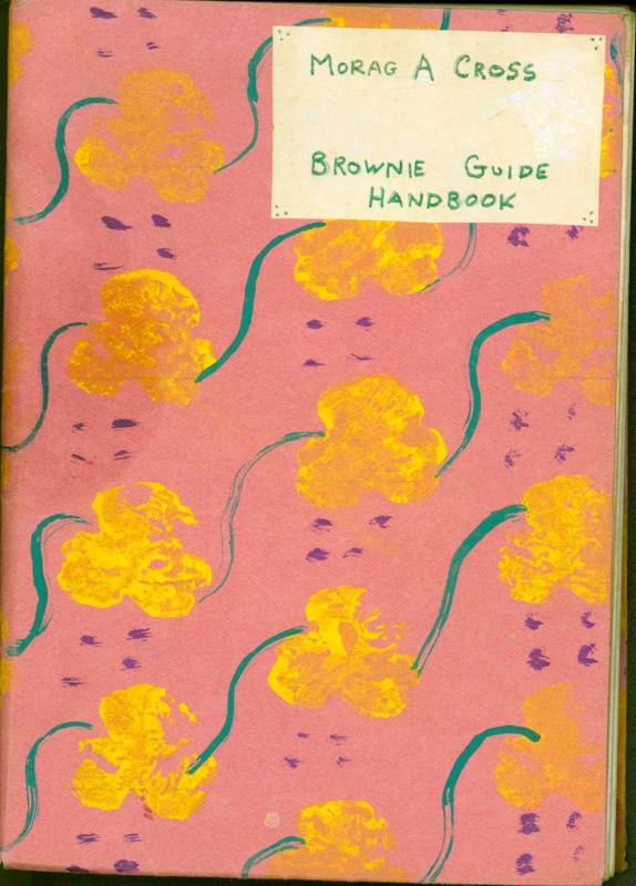 The Brownie Guide Handbook wrapped in handpainted paper
