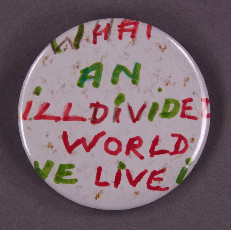 Badge: What An Ill Divided World We Live In; 2013; GWL-2013-31-1