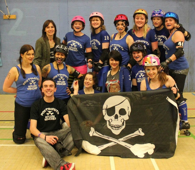 Portsmouth Roller Wenches with Skull and Skatebones flag at Croyden Roller Derby, Feb 2013; GWL-2022-120-1