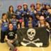 Portsmouth Roller Wenches with Skull and Skatebones flag at Croyden Roller Derby, Feb 2013; GWL-2022-120-1