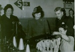 IET Archives postcard featuring black and white image of a royal visit to a stocking factory, 1946