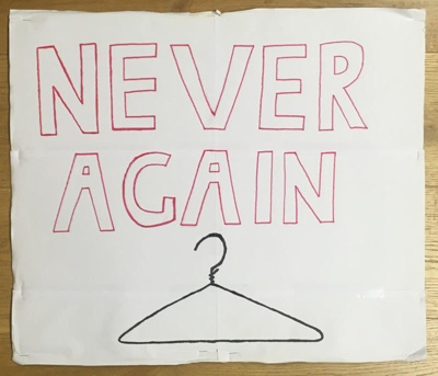 Placard: Never Again; Glasgow Students for Choice; 2023; GWL-2023-55-8