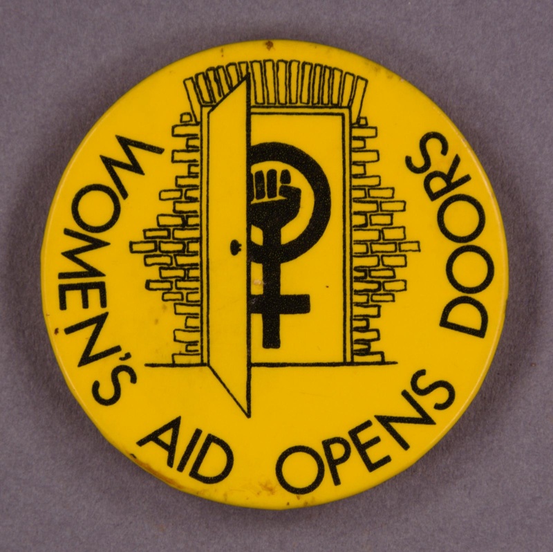 Badge: Women's Aid Opens Doors; c.1980s; GWL-2015-111-48