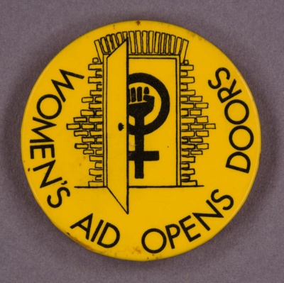 Badge: Women's Aid Opens Doors; c.1980s; GWL-2015-111-48