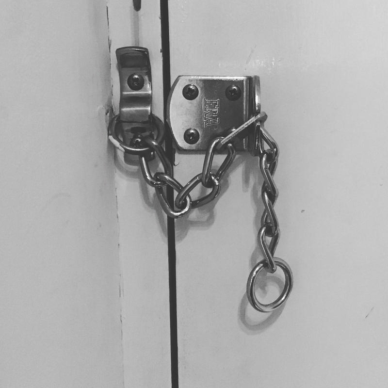 Photographic lockdown print by Bidisha (2020) depicting a padlock and chain