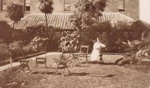 Louise Schmidt in the yard behind Hampton Hotel; c1920; P0119