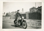 Ronald Edgar Bower on a motorcycle in Trentham Street, Sandringham; 1955; P8943