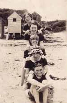 Group in bathers on beach; c. 1920; P2490