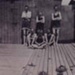 Local lads in swimming costumes, outside the boat sheds at Tom Woods pier.; 1921; P0487