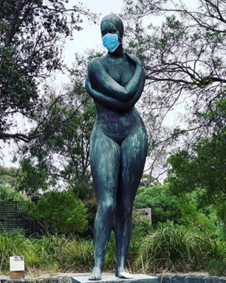 Guy Boyd's sculpture of The Swimmer wearing a face mask; Bell, Nicole; 2021 Jul. 18; PD3242